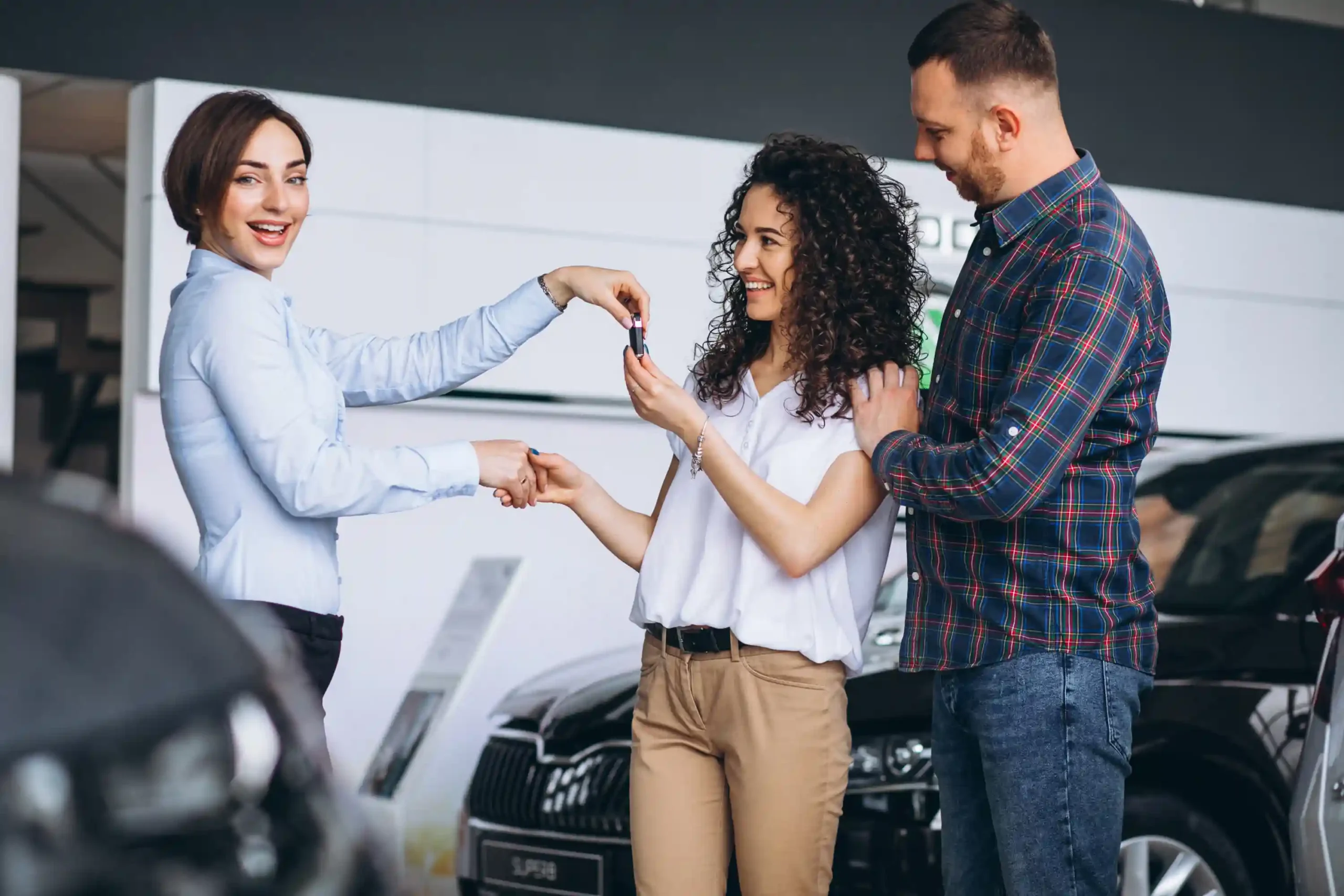 young-couple-byuing-car-car-showroom young-couple-byuing-car-car-showroom