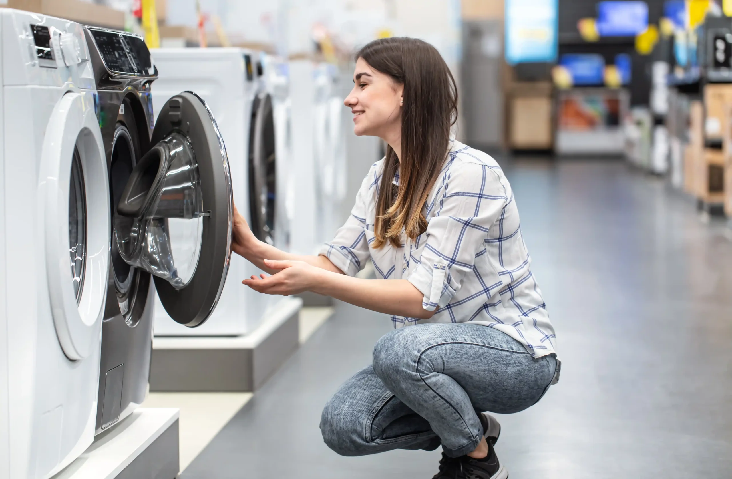 young-woman-store-chooses-washing-machine young-woman-store-chooses-washing-machine